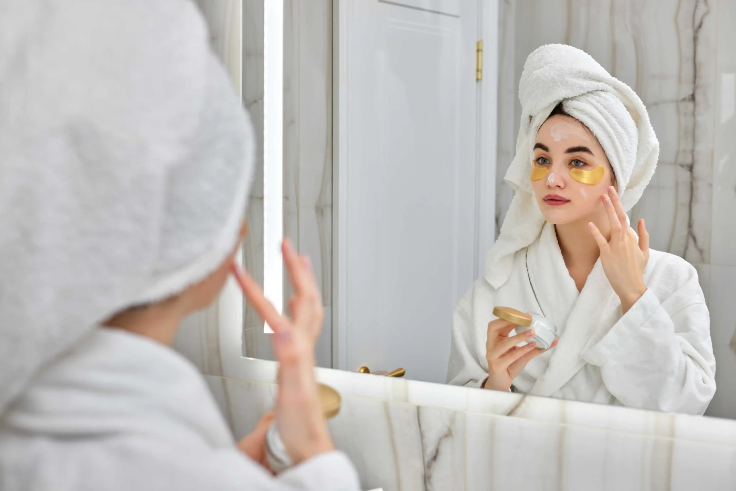 Close up of woman applying eye cream expanding skincare line with targeted eye care products - Zicail Beauty - Zicail Beauty Close up of woman applying eye cream expanding skincare line with targeted eye care products - <trp-post-container data-trp-post-id='38'>Skincare Products</trp-post-container> - Skincare Products