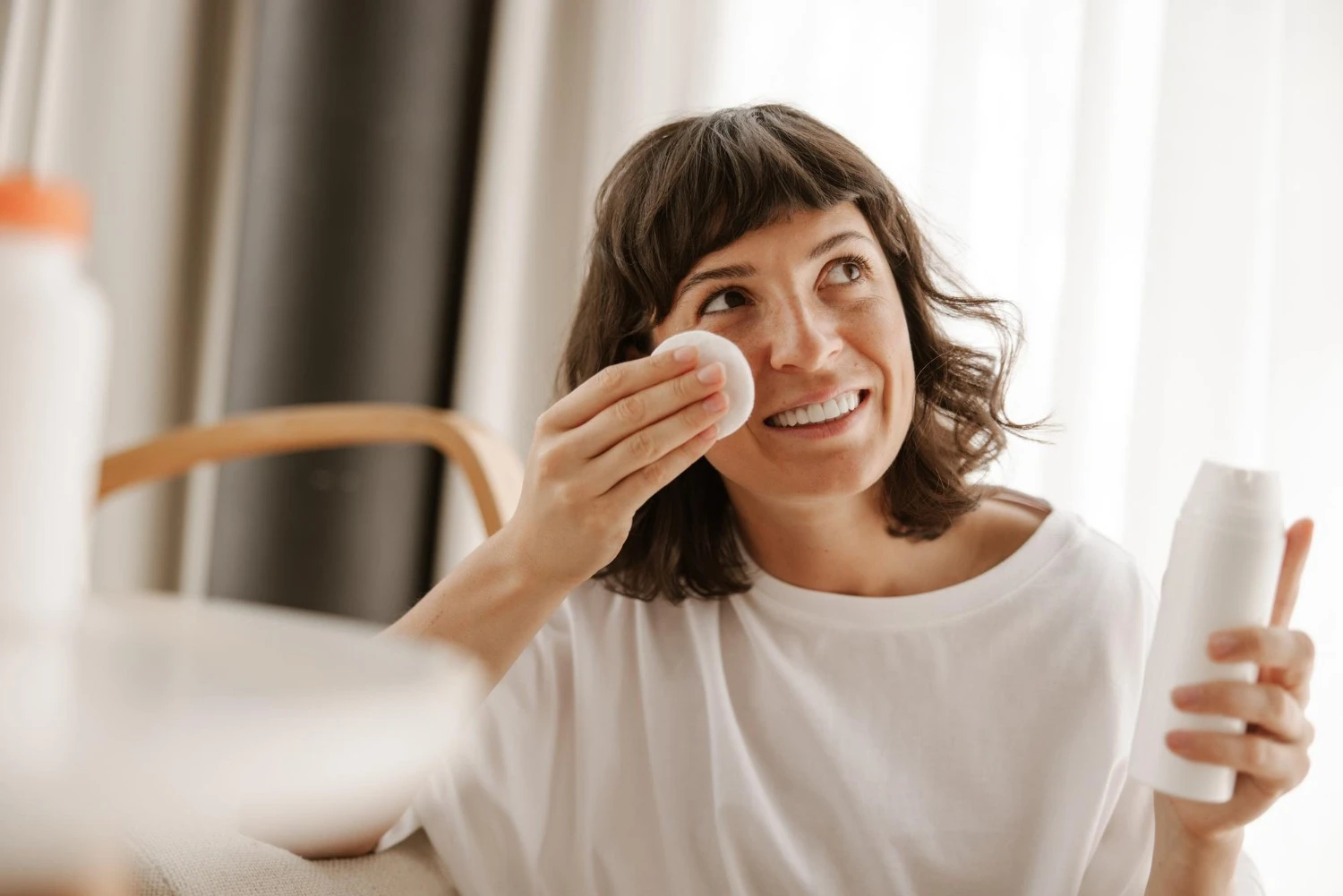 Woman applying toner with cotton pad prep and hydration step in face care routine - Zicail Beauty - Zicail Beauty Woman applying toner with cotton pad prep and hydration step in face care routine - Face Care Products - Face Care Products