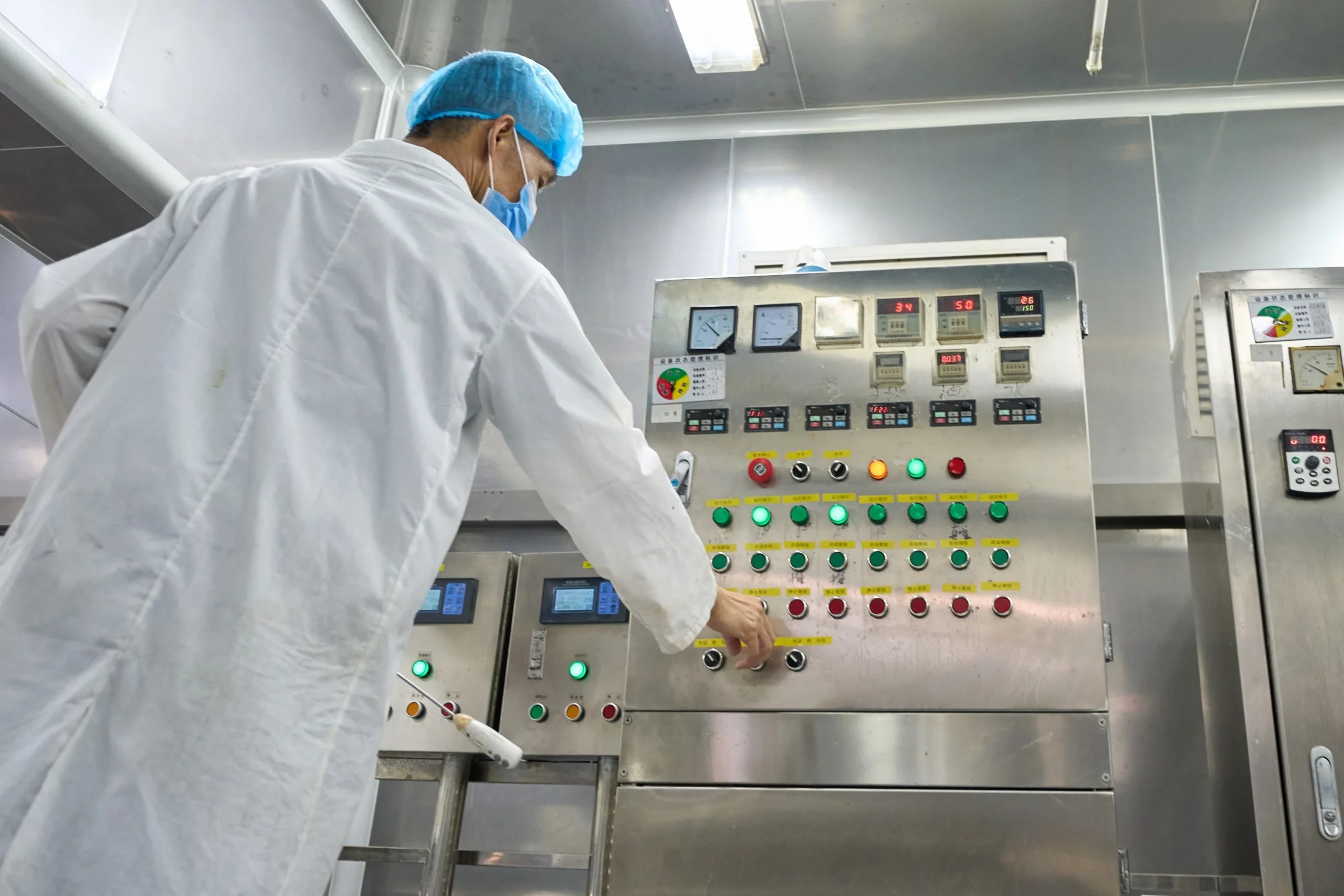 ZICAIL operator controlling bulk skincare manufacturing equipment in the production room